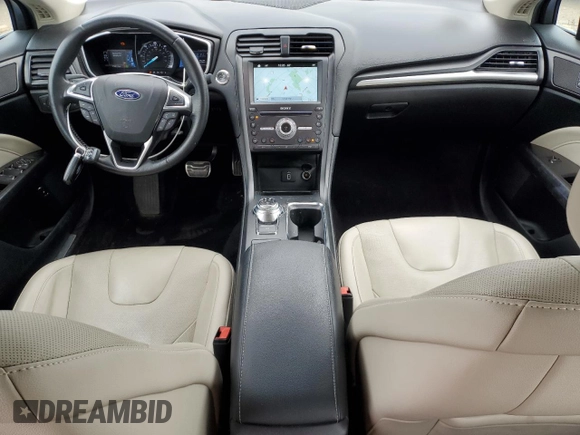 2017 Ford Fusion Hybrid Titanium with VIN 3FA6P0RU1HR138725, listed as a Copart auction lot 56650625 with 77,331 mi miles and Salvage title. Bid and sale history available at DreamBid. Image 8.