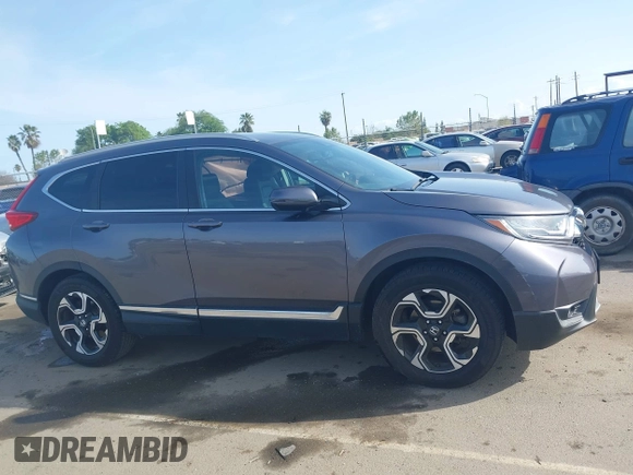 2018 Honda CR-V Touring with VIN 7FARW1H93JE027294, listed as a IAAI auction lot 41903484 with 80,999 mi miles and . Bid and sale history available at DreamBid. Image 14.