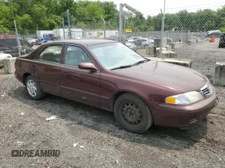 2000 Mazda 626 LX z VIN 1YVGF22C4Y5112874, wystawiony jako Copart lot #58952175 z przebiegiem 100 070 mil mil oraz Szkoda całkowita • Salvage title. Historia ofert i sprzedaży dostępna na DreamBid. Obrazek 4.