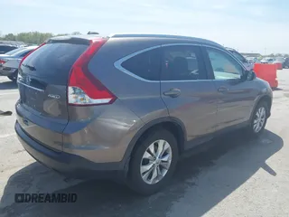 2014 Honda CR-V EX-L with VIN 5J6RM4H70EL096555, listed as a IAAI auction lot 42038062 with 113,601 mi miles. Bid and sale history available at carsss.com. Image 4.
