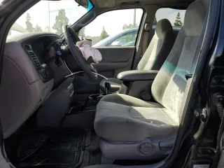 2001 Mazda Tribute LX with VIN 4F2YU09151KM38909, listed as a Copart auction lot 77808264 with 136,005 mi miles and Salvage Title. Bid and sale history available at carsss.com. Image 7.
