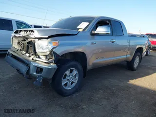 2014 Toyota Tundra 4WD Truck SR with VIN 5TFUW5F19EX330781, listed as a IAAI auction lot 41754261 with 168,388 mi miles. Bid and sale history available at carsss.com. Image 18.