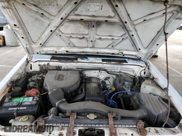 1995 Nissan Frontier with VIN 1N6SD11S3SC379478, listed as a Copart auction lot 52209415 with 21,068 mi miles and Salvage title. Bid and sale history available at DreamBid. Image 11.