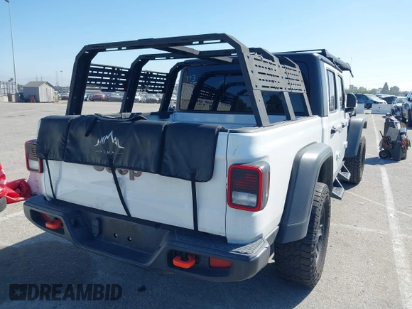 2022 Jeep Gladiator Mojave z VIN 1C6JJTEG0NL103523, wystawiony jako IAAI lot #41842011 z przebiegiem 36 160 mil mil oraz . Historia ofert i sprzedaży dostępna na DreamBid. Obrazek 4.