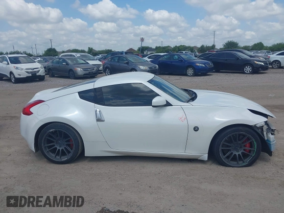 2012 Nissan 370Z z VIN JN1AZ4EH5CM564517, wystawiony jako IAAI lot #42385869 z przebiegiem 55 359 mil mil oraz . Historia ofert i sprzedaży dostępna na DreamBid. Obrazek 14.