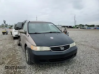 2003 Honda Odyssey EX z VIN 5FNRL186X3B152340, wystawiony jako Copart lot #57883455 z przebiegiem 214 008 mil mil oraz Szkoda całkowita • Salvage title. Historia ofert i sprzedaży dostępna na DreamBid. Obrazek 14.