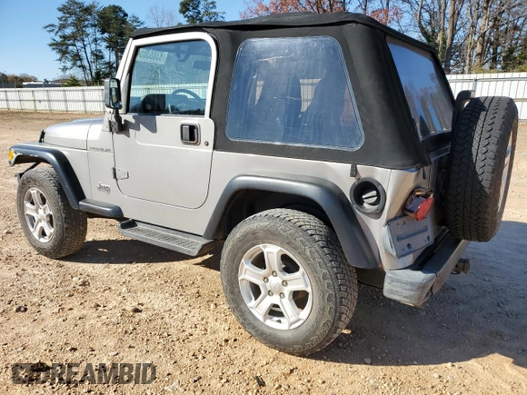 2001 Jeep Wrangler SE with VIN 1J4FA29P11P334902, listed as a Copart auction lot 83883654 with 157,827 mi miles and Salvage Title. Bid and sale history available at carsss.com. Image 2.