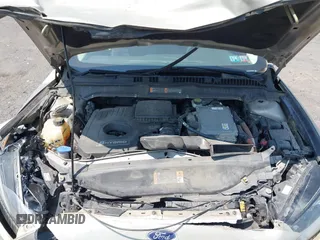 2015 Ford Fusion SE Hybrid z VIN 3FA6P0LU3FR163695, wystawiony jako IAAI lot #42428393 z przebiegiem 237 835 mil mil oraz . Historia ofert i sprzedaży dostępna na DreamBid. Obrazek 10.