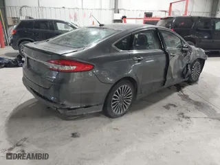 2018 Ford Fusion Hybrid Titanium with VIN 3FA6P0RU1JR117010, listed as a IAAI auction lot 41603439 with 124,151 mi miles. Bid and sale history available at carsss.com. Image 4.