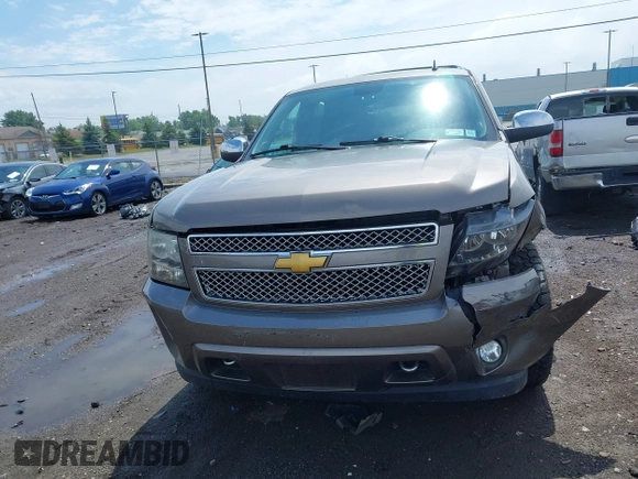 2013 Chevrolet Tahoe LTZ with VIN 1GNSKCE0XDR373858, listed as a IAAI auction lot 42456875 with 297,084 mi miles and . Bid and sale history available at DreamBid. Image 12.