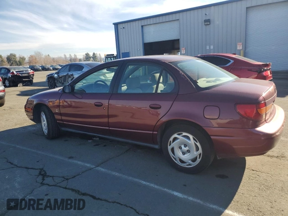 2001 Saturn SL z VIN 1G8ZK54731Z305098, wystawiony jako Copart lot #83875424 z przebiegiem 82 879 mil mil oraz Tytuł czysty. Historia ofert i sprzedaży dostępna na DreamBid. Obrazek 2.