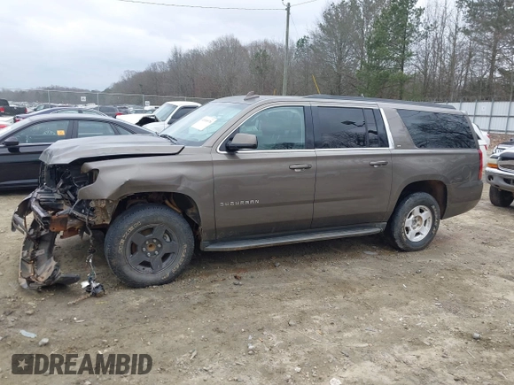 2015 Chevrolet Suburban LT z VIN 1GNSCJKC6FR675585, wystawiony jako IAAI lot #41510570 z przebiegiem 156 818 mil mil oraz . Historia ofert i sprzedaży dostępna na DreamBid. Obrazek 13.