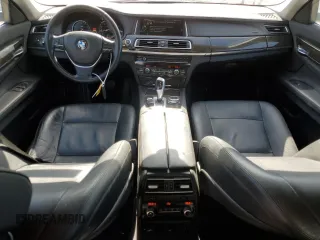 2014 BMW 7 Series 740i with VIN WBAYA6C55ED144487, listed as a Copart auction lot 77044014 with 86,149 mi miles and Salvage Title. Bid and sale history available at carsss.com. Image 8.