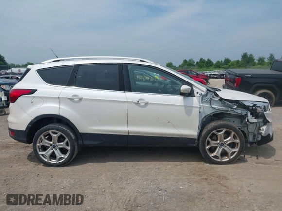 2019 Ford Escape Titanium with VIN 1FMCU9J90KUA86338, listed as a IAAI auction lot 42690159 with 115,891 mi miles and . Bid and sale history available at DreamBid. Image 14.