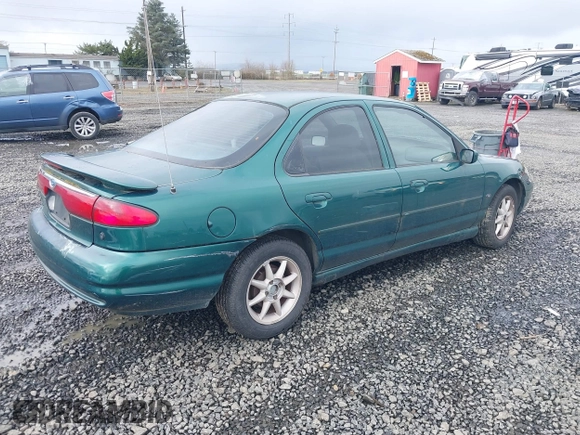 1999 Ford Contour SE Fleet with VIN 1FAFP66L3XK227522, listed as a IAAI auction lot 41702873 with 140,926 mi miles. Bid and sale history available at carsss.com. Image 4.