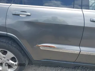2011 Jeep Grand Cherokee Laredo with VIN 1J4RR4GG3BC595896, listed as a IAAI auction lot 42632333 with 135,426 mi miles and . Bid and sale history available at DreamBid. Image 6.