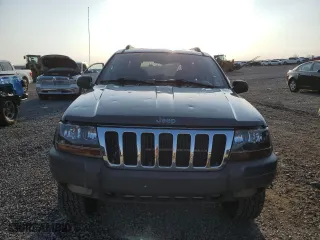 2002 Jeep Grand Cherokee Laredo with VIN 1J4GW48N32C180185, listed as a Copart auction lot 51988335 with 212,399 mi miles and Salvage Title. Bid and sale history available at carsss.com. Image 6.