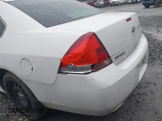 2013 Chevrolet Impala Police with VIN 2G1WD5E33D1210058, listed as a IAAI auction lot 41574143 with 156,643 mi miles. Bid and sale history available at carsss.com. Image 6.