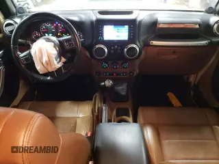 2011 Jeep Wrangler Sahara with VIN 1J4AA5D19BL577347, listed as a Copart auction lot 80340124 with 148,986 mi miles and Salvage Title. Bid and sale history available at DreamBid. Image 8.