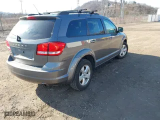 2013 Dodge Journey American Value Pkg with VIN 3C4PDCAB3DT556607, listed as a IAAI auction lot 41519379 with 80,265 mi miles. Bid and sale history available at carsss.com. Image 4.