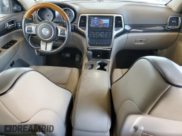 2013 Jeep Grand Cherokee Overland with VIN 1C4RJECT7DC526119, listed as a Copart auction lot 60735594 with 143,454 mi miles and Clean Title. Bid and sale history available at carsss.com. Image 8.