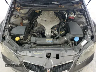 2009 Pontiac G8 z VIN 6G2ER57769L192376, wystawiony jako Copart lot #58634365 z przebiegiem 206 095 mil mil oraz Tytuł czysty. Historia ofert i sprzedaży dostępna na DreamBid. Obrazek 11.