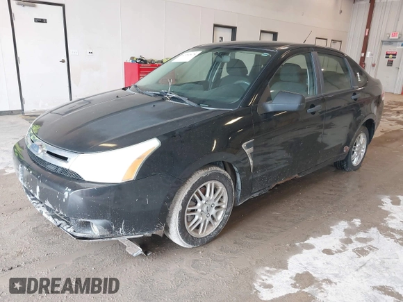 2009 Ford Focus SE with VIN 1FAHP35N69W128084, listed as a IAAI auction lot 42202678 with 290,358 mi miles. Bid and sale history available at carsss.com. Image 2.