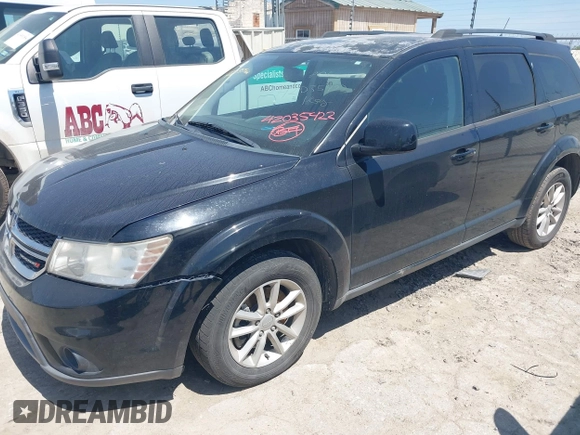 2015 Dodge Journey SXT with VIN 3C4PDCBB0FT708876, listed as a IAAI auction lot 42035422 with 157,669 mi miles. Bid and sale history available at carsss.com. Image 2.