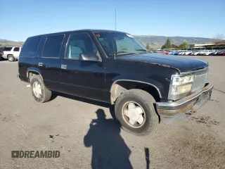 1996 GMC Yukon with VIN 1GKEK13R1TJ741714, listed as a Copart auction lot 46814635 with 406,969 mi miles and Salvage Title. Bid and sale history available at carsss.com. Image 4.