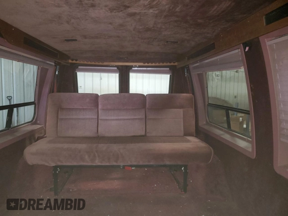 1992 Chevrolet Chevy Van z VIN 2GBEG25K3N4150299, wystawiony jako Copart lot #74099444 z przebiegiem 156 341 mil mil oraz Tytuł czysty. Historia ofert i sprzedaży dostępna na DreamBid. Obrazek 10.