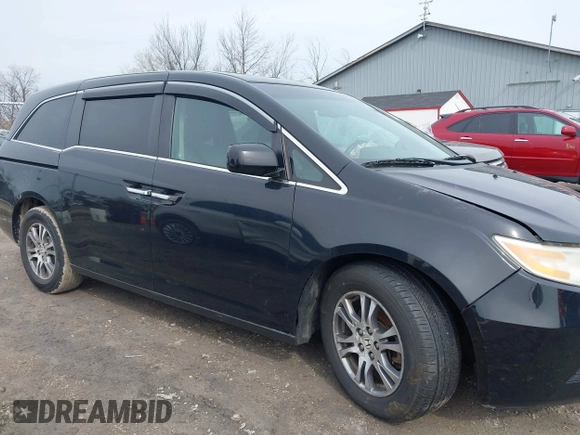 2012 Honda Odyssey EX-L with VIN 5FNRL5H63CB070361, listed as a IAAI auction lot 42025024 with 152,258 mi miles and . Bid and sale history available at carsss.com. Image 13.