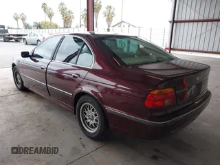 1997 BMW 5 Series 528iA with VIN WBADD6323VBW15656, listed as a IAAI auction lot 41777667 with 142,443 mi miles. Bid and sale history available at carsss.com. Image 3.
