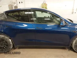 2021 Tesla Model Y Long Range with VIN 5YJYGDEE2MF185945, listed as a IAAI auction lot 41599029 with 53,815 mi miles and . Bid and sale history available at DreamBid. Image 14.