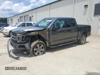 2018 Ford F-150 XL with VIN 1FTEW1EG5JFE14390, listed as a Copart auction lot 59358115 with 180,894 mi miles and Salvage title. Bid and sale history available at DreamBid. Image 1.