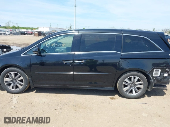 2014 Honda Odyssey Touring with VIN 5FNRL5H94EB079518, listed as a IAAI auction lot 42095098 with 141,019 mi miles and . Bid and sale history available at DreamBid. Image 15.