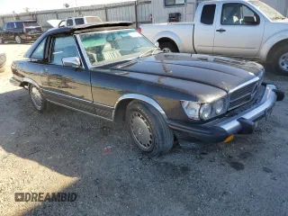 1987 Mercedes-Benz 560 SL with VIN WDBBA48D1HA072141, listed as a Copart auction lot 79715724 with 88,545 mi miles and Salvage Title. Bid and sale history available at DreamBid. Image 4.