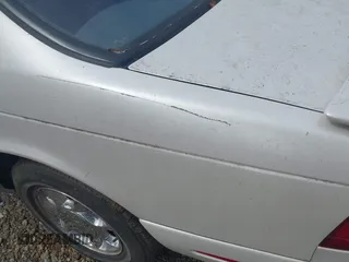 1997 Ford Thunderbird LX with VIN 1FALP62W6VH142784, listed as a IAAI auction lot 41792883 with 244,300 mi miles. Bid and sale history available at carsss.com. Image 12.
