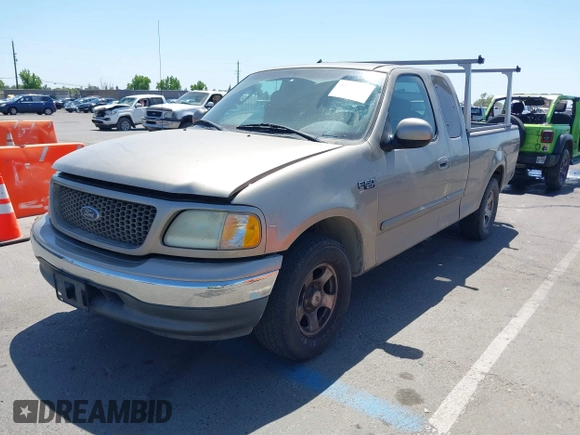 2002 Ford F-150 XL with VIN 1FTRX17272KE07014, listed as a IAAI auction lot 42381725 with 212,294 mi miles and . Bid and sale history available at DreamBid. Image 2.
