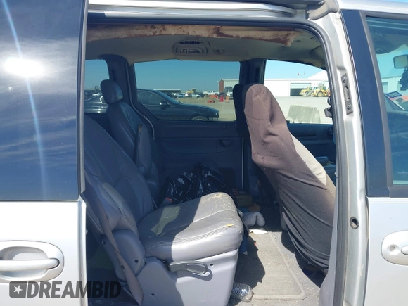 1999 Chrysler Town & Country LXi with VIN 1C4GP54L9XB872347, listed as a IAAI auction lot 41611666 with 224,817 mi miles. Bid and sale history available at carsss.com. Image 8.