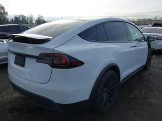 2023 Tesla Model X with VIN 7SAXCBE54PF384403, listed as a IAAI auction lot 40947187 with 16,881 mi miles and . Bid and sale history available at DreamBid. Image 4.