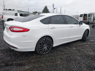 2013 Ford Fusion SE with VIN 3FA6P0H79DR126179, listed as a IAAI auction lot 41129882 with 176,135 mi miles. Bid and sale history available at carsss.com. Image 4.