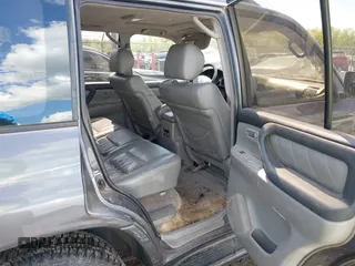 2003 Toyota Land Cruiser z VIN JTEHT05J932041288, wystawiony jako IAAI lot #42000615 z przebiegiem 166 159 mil mil oraz . Historia ofert i sprzedaży dostępna na DreamBid. Obrazek 8.