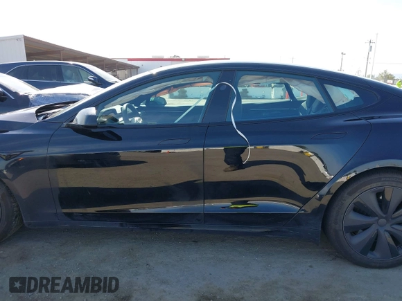 2023 Tesla Model S with VIN 5YJSA1E54PF531021, listed as a IAAI auction lot 42014104 with Not provided miles and . Bid and sale history available at DreamBid. Image 14.