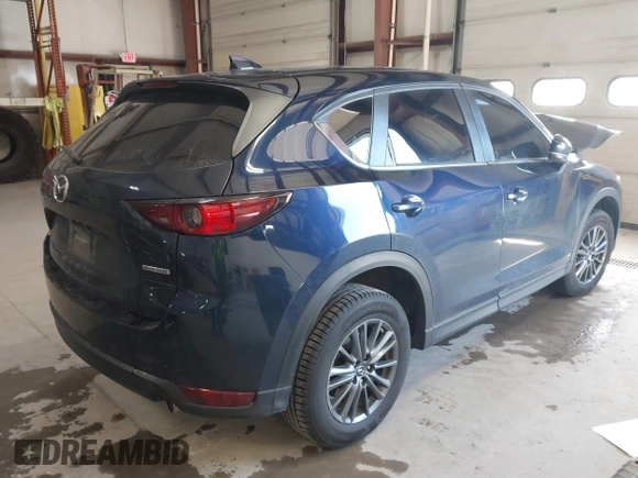 2020 Mazda CX-5 Touring with VIN JM3KFBCM6L0739077, listed as a IAAI auction lot 41810946 with 82,911 mi miles and . Bid and sale history available at carsss.com. Image 4.