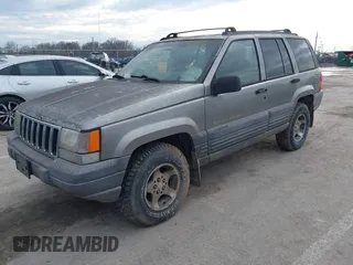 1997 Jeep Grand Cherokee Laredo with VIN 1J4GZ58S4VC745129, listed as a IAAI auction lot 41641005 with 1 mi miles. Bid and sale history available at carsss.com. Image 2.