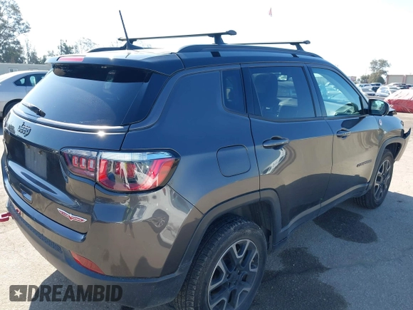 2019 Jeep Compass Trailhawk with VIN 3C4NJDDB3KT759849, listed as a IAAI auction lot 42141467 with 100,915 mi miles and . Bid and sale history available at DreamBid. Image 4.