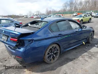 2022 BMW 5 Series M550i xDrive with VIN WBA13BK08NCJ54124, listed as a IAAI auction lot 41977413 with Not provided miles and . Bid and sale history available at DreamBid. Image 4.