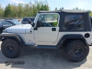 2003 Jeep Wrangler Sport z VIN 1J4FA49S73P302278, wystawiony jako IAAI lot #42219582 z przebiegiem 129 089 mil mil oraz . Historia ofert i sprzedaży dostępna na DreamBid. Obrazek 14.