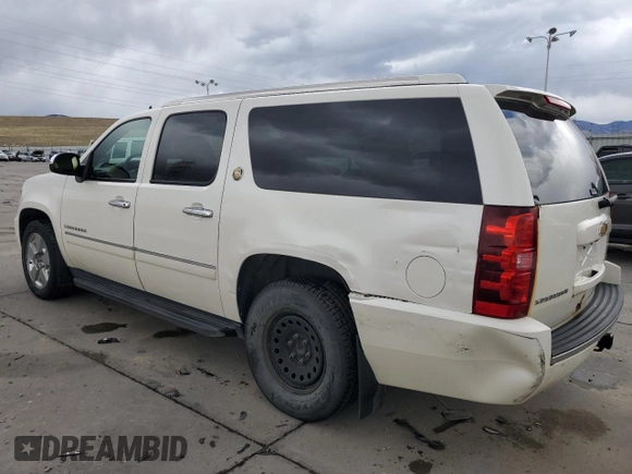 2010 Chevrolet Suburban LTZ with VIN 1GNUKKE35AR292291, listed as a Copart auction lot 49627085 with 233,359 mi miles and Salvage Title. Bid and sale history available at carsss.com. Image 2.