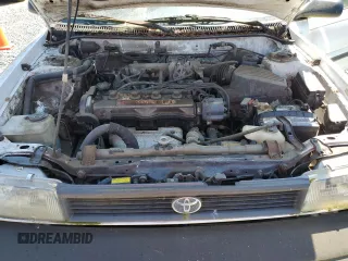 1991 Toyota Corolla z VIN JT2AE94A6M3427211, wystawiony jako Copart lot #60075885 z przebiegiem 179 936 mil mil oraz Czysty tytuł • Clean title. Historia ofert i sprzedaży dostępna na DreamBid. Obrazek 11.